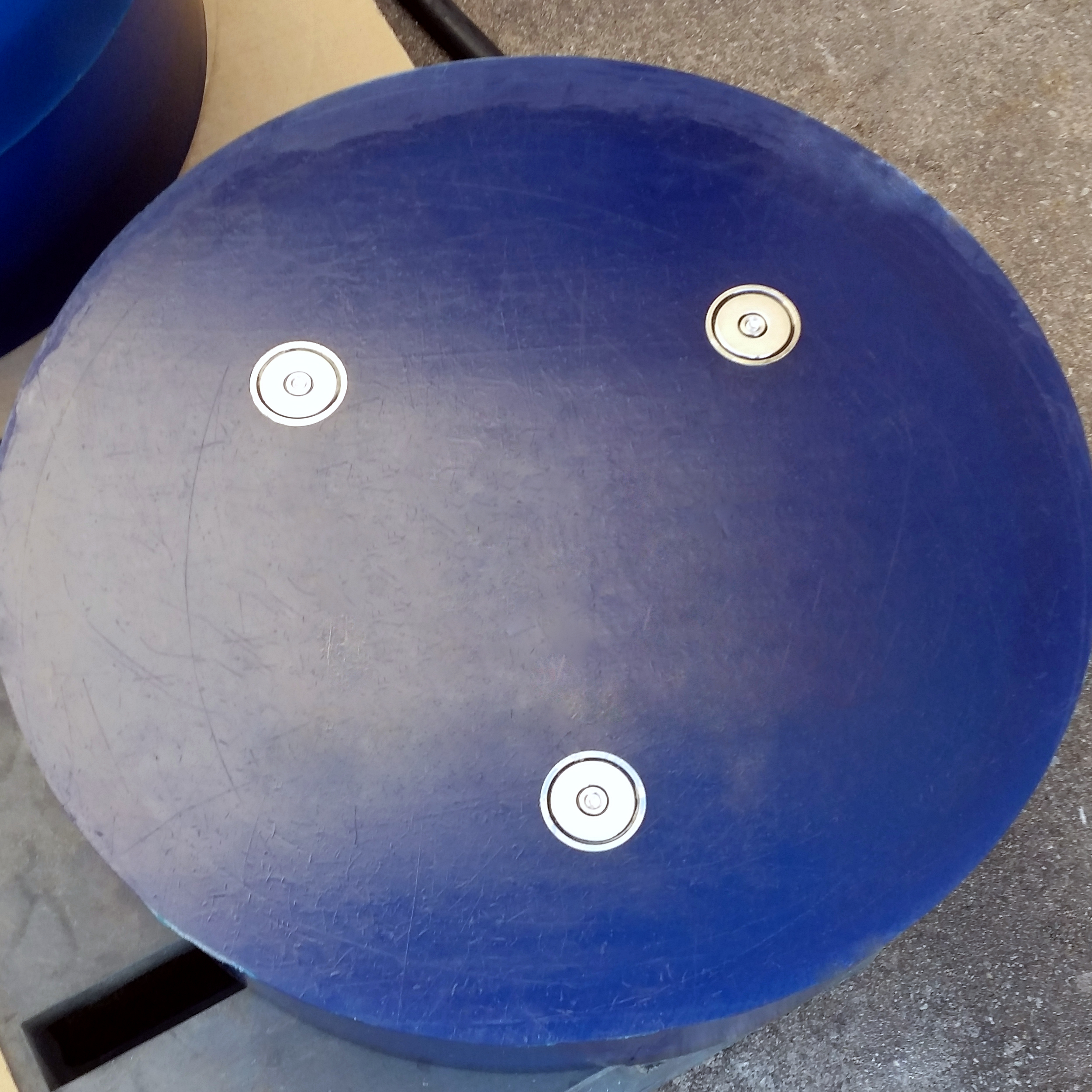 Blue Polyurethane with magnets inset bonding polyurethane to metal.