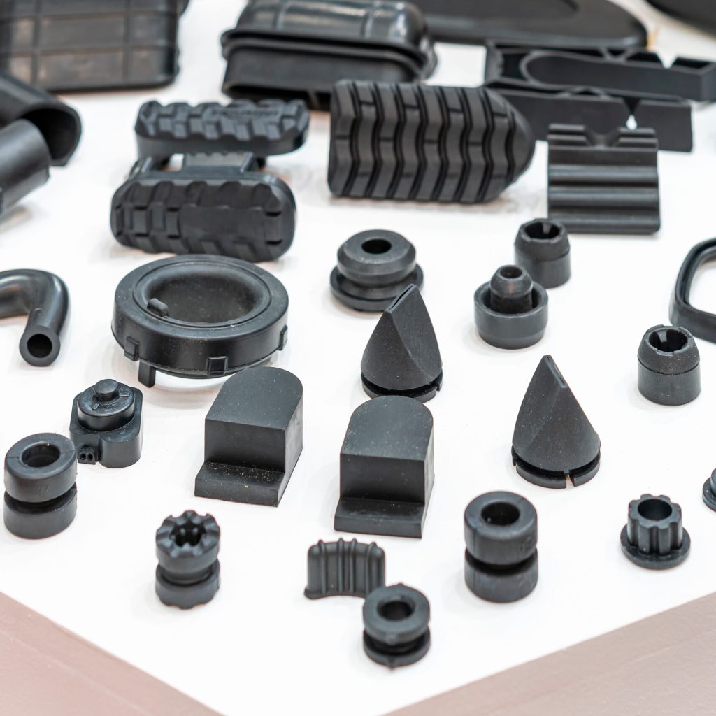 Various compression molded rubber sample parts made from manufacturing process in industrial e.g. plug cover cap pipe tube pedal nozzle connector and automobile parts other